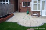 Garden was on a new development new Saxon paving with circle feature installed new lawn, stepping stones and low planter wall summer house with hot tub and lighting installed